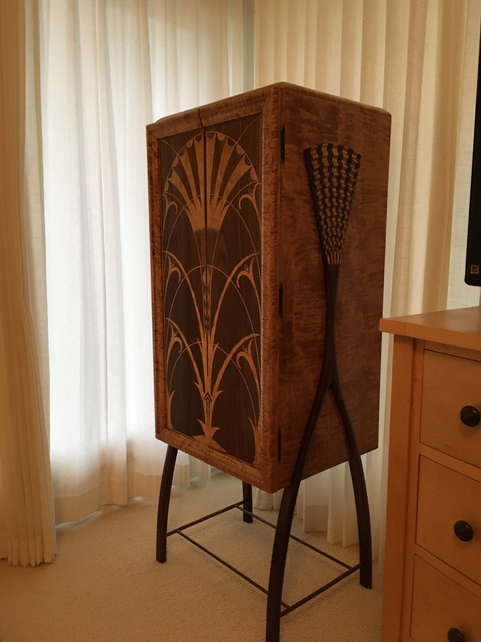 Cabinet inspired by the elevator doors in the Chrysler Building 