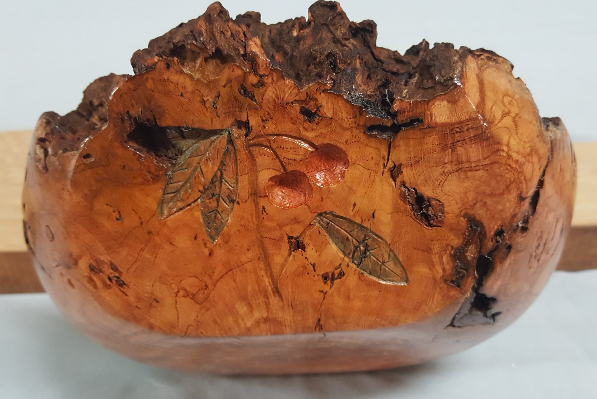 Cherry Burl Turned and Carved with translucent color.