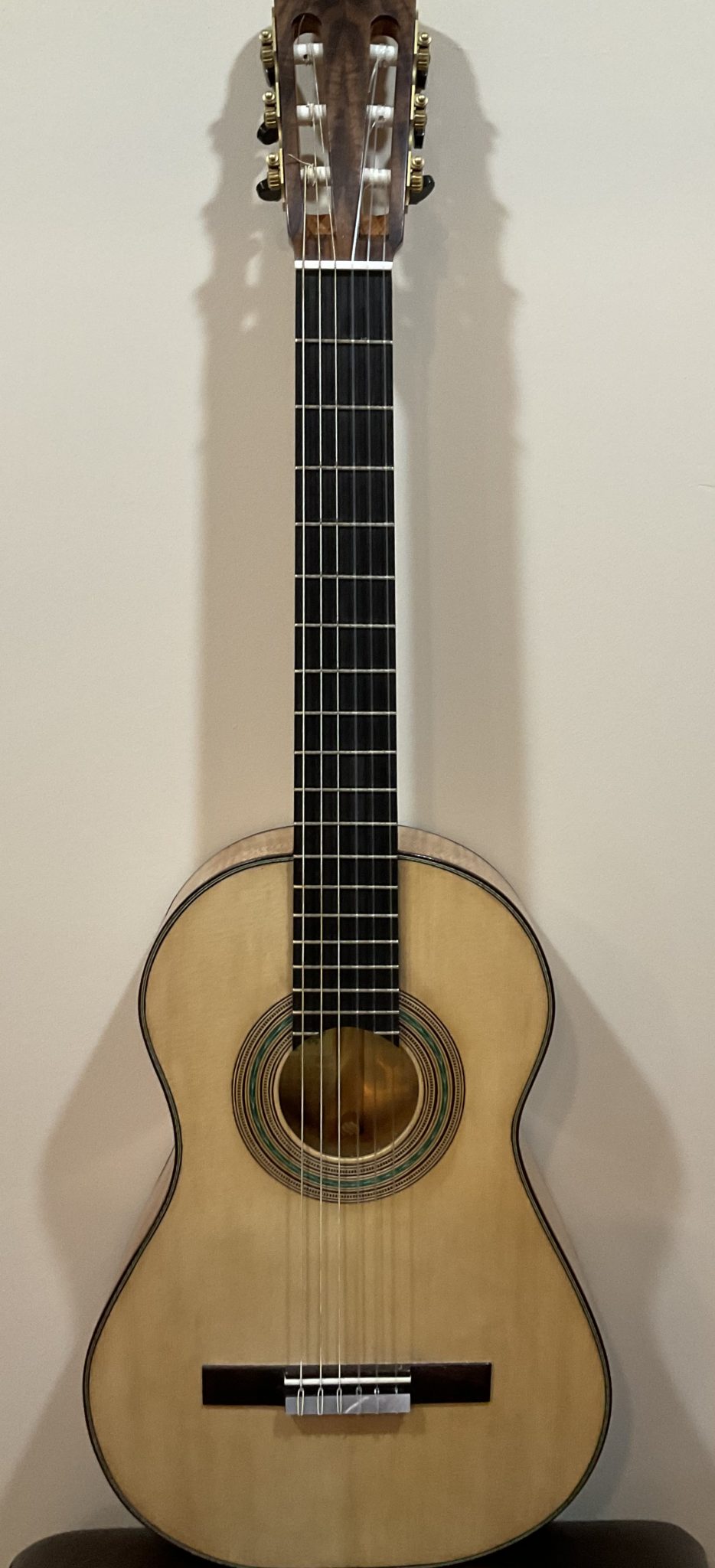 A classical guitar modeled on those of Antonio Torres and built using traditional hand tools and materials.