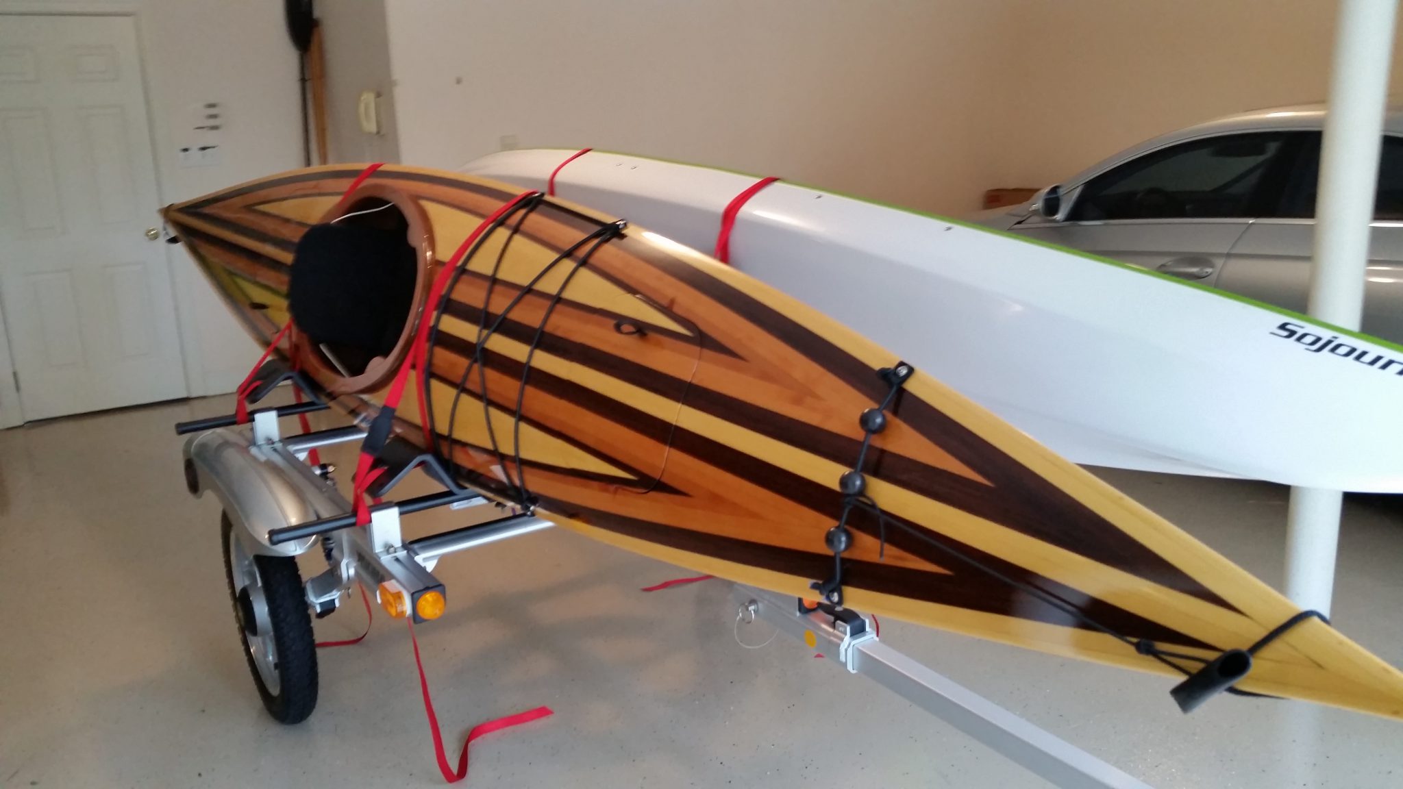 Kayak with multiple types of wood