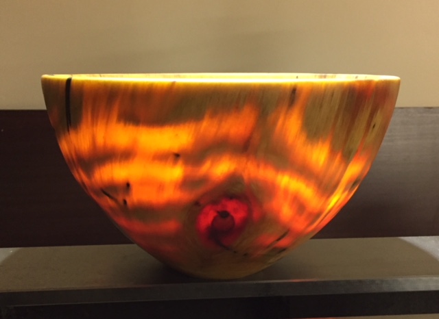 Translucent bowl made by soaking Norfolk Pine in linseed oil before turning