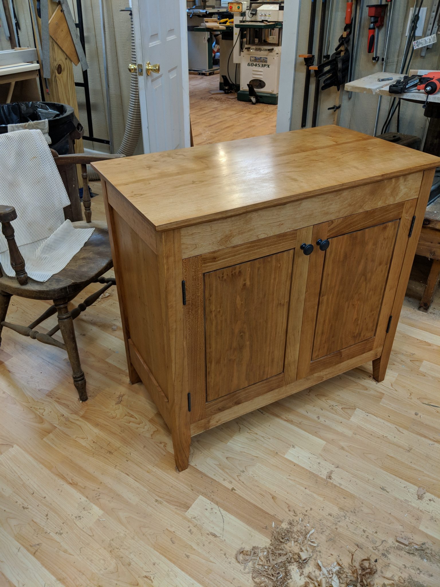 Cherry solids and plywood custom cabinet with shaker doors
