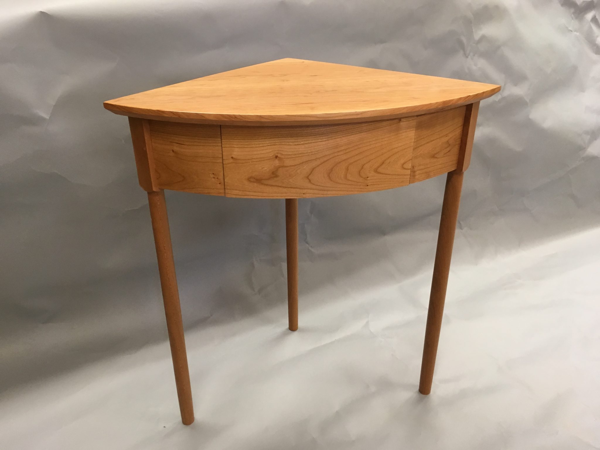 3 leg corner table in cherry with drawer
