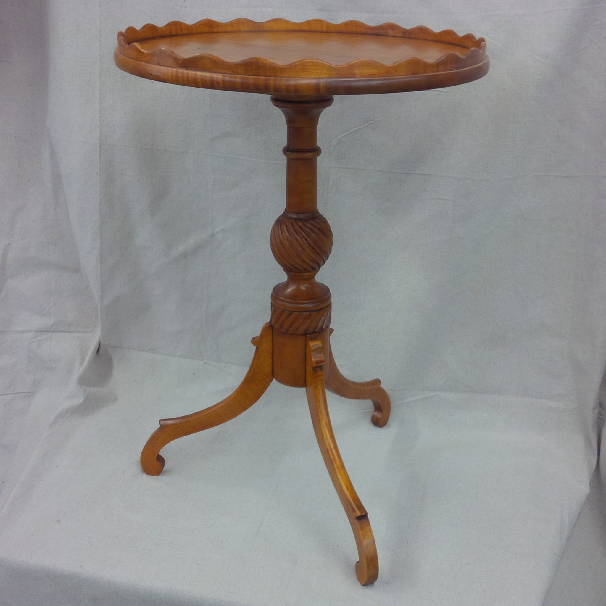 Period pie crust table in curly maple with fine tooling