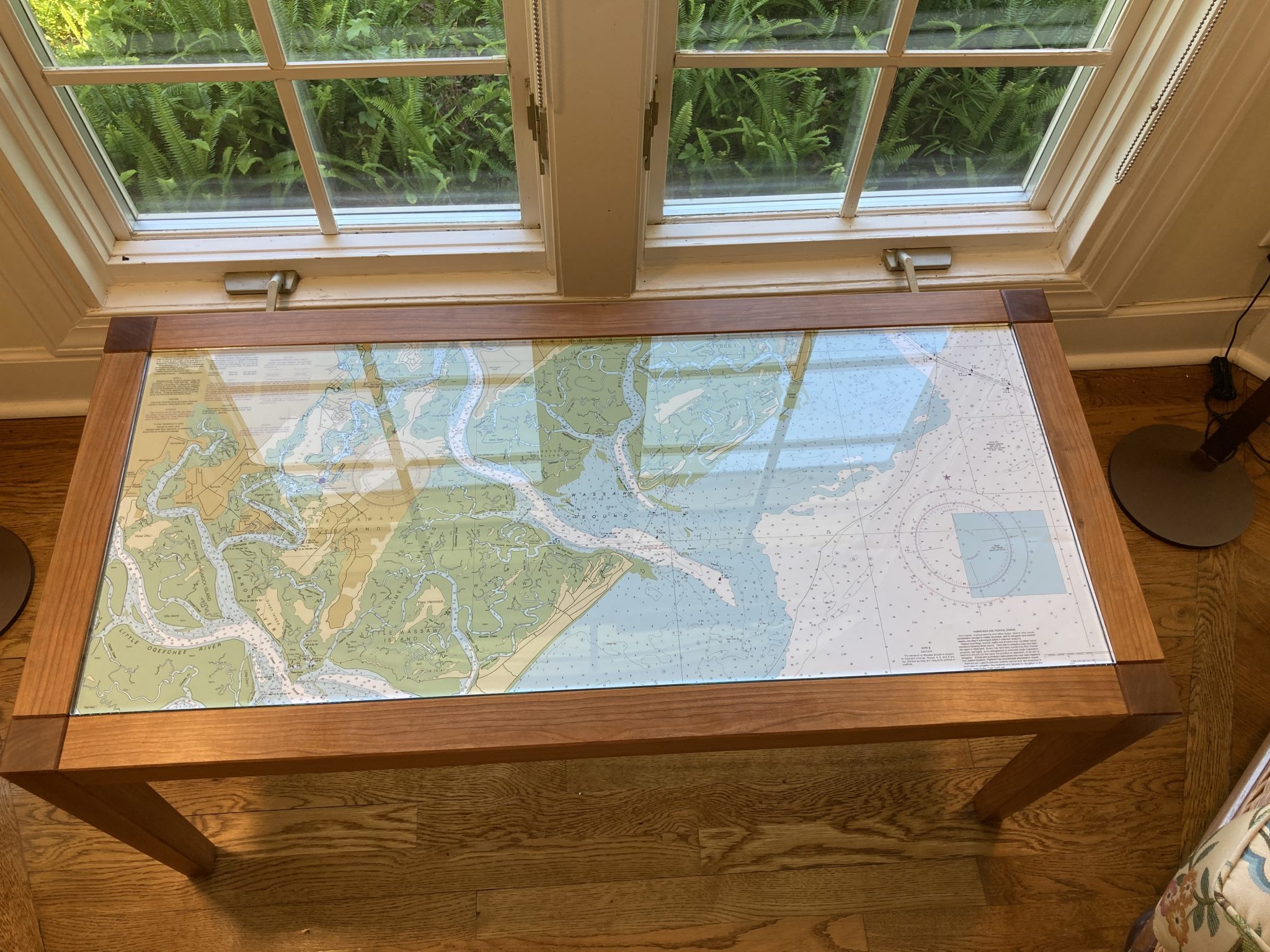 Table with inserted chart of Savannah waters in cherry