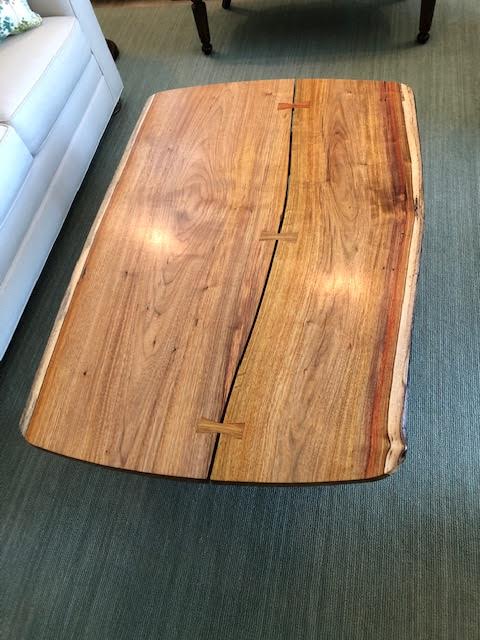 Exotic wood live edge coffee table with butterfly inlay.