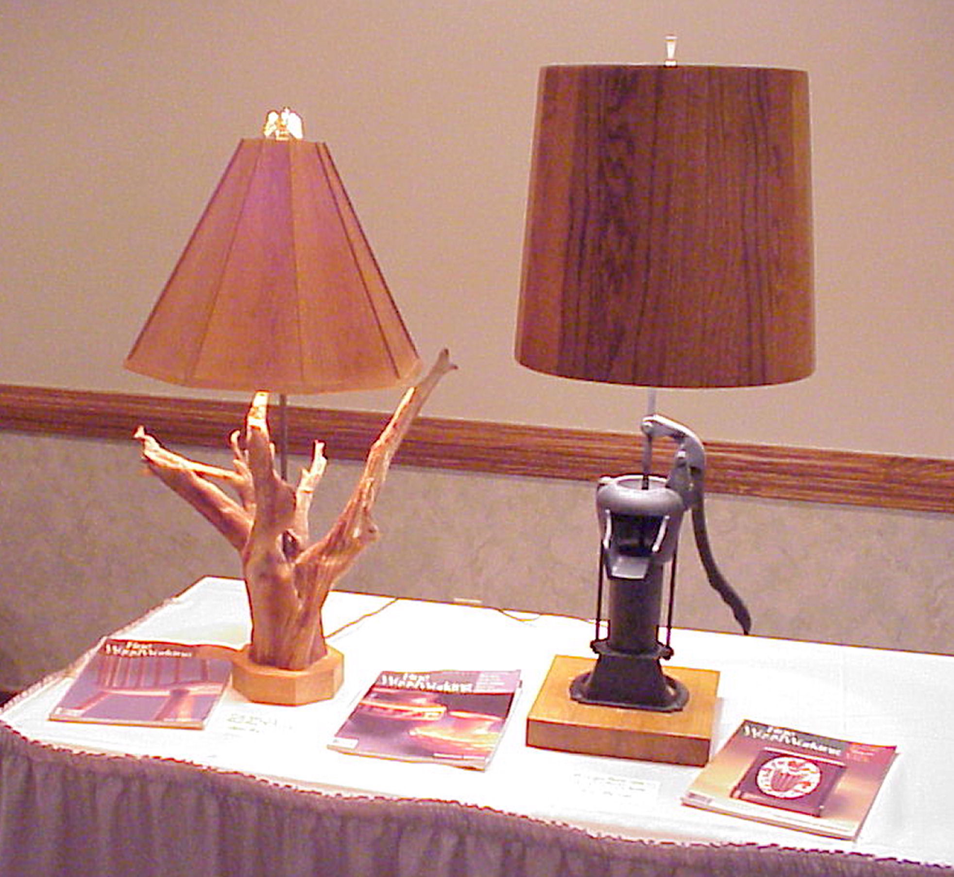 Oak and Pine Table Lamps.  The one with the Pine Shade has a Pine tree root taken from a colonial american farmers fence line.  The one with the Oak Shade has an antique Pitcher Pump as a base. 
