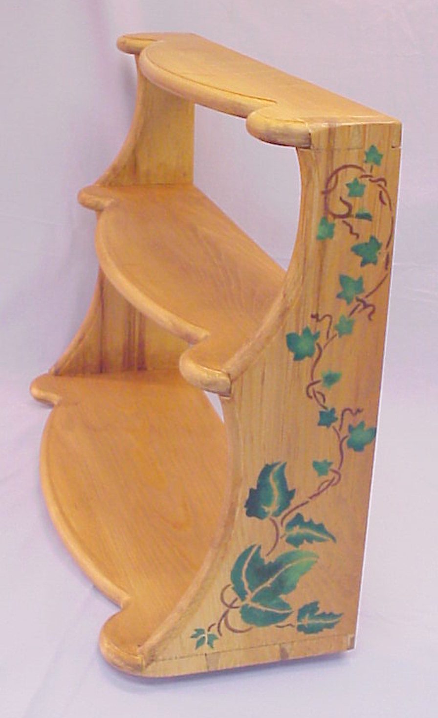Pine Wall hanging shelf with polychrome stenciled decoration, and hand cut dovetails.