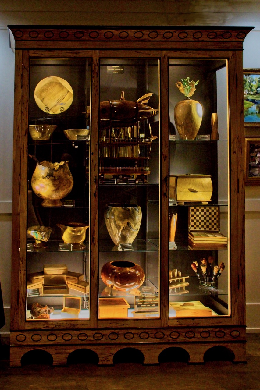 LWG woodworkers displayed art work in the display cabinet built by the guild