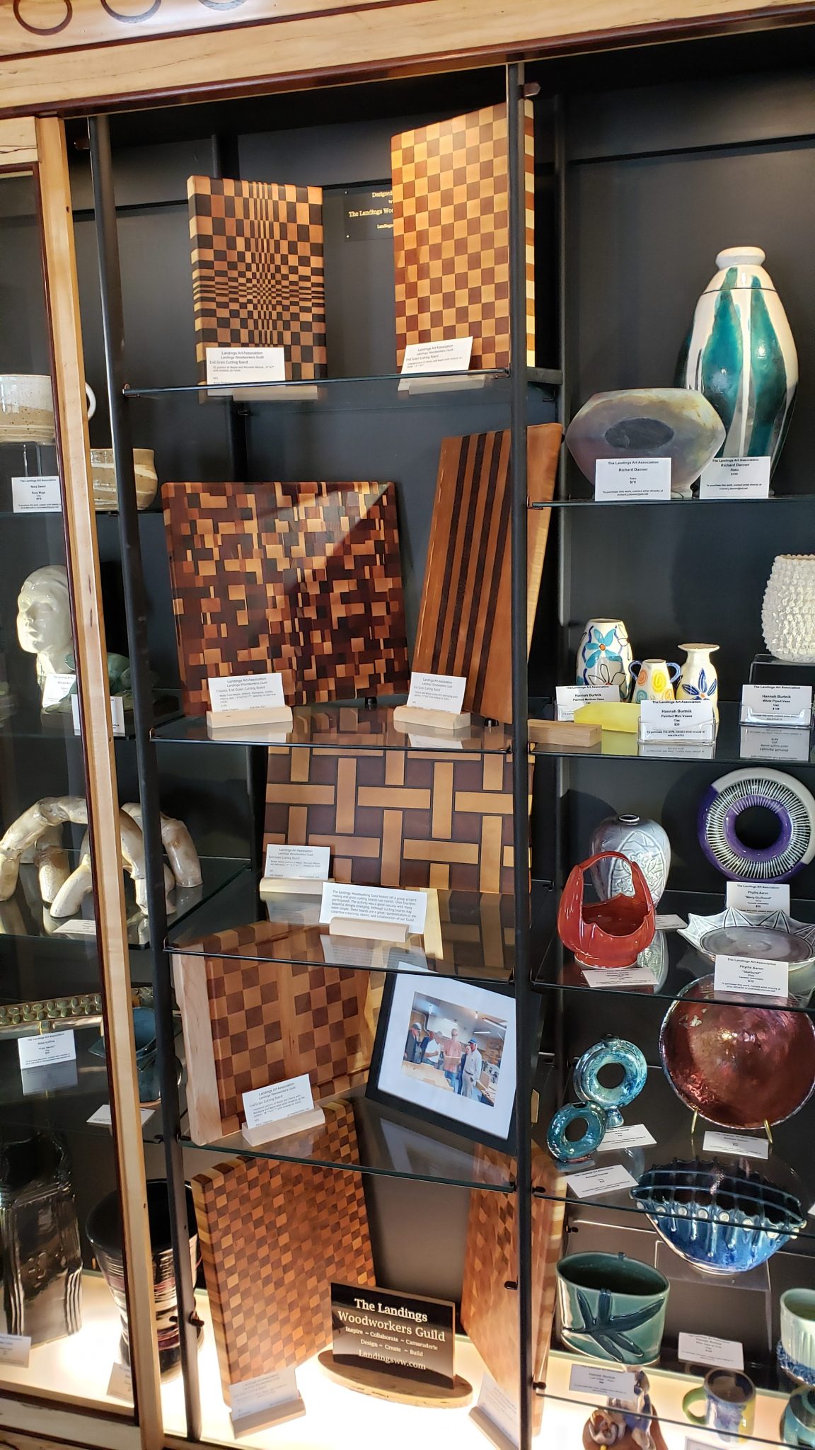 The LWG display cabinet full of cutting boards from the John Weaver led end grain cutting board project.