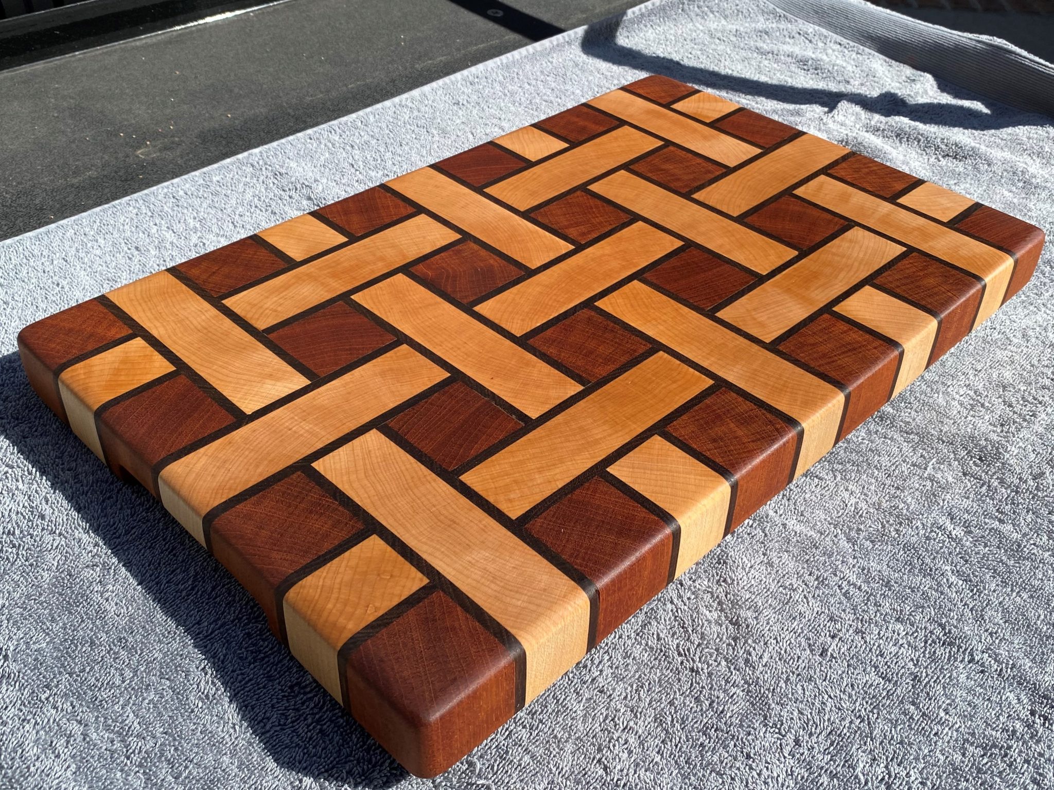 End Grain Cutting Board   1 1/2" x 11 1/4" x 17"  Constructed of Hard Maple, Peruvian Walnut, and Mahogany