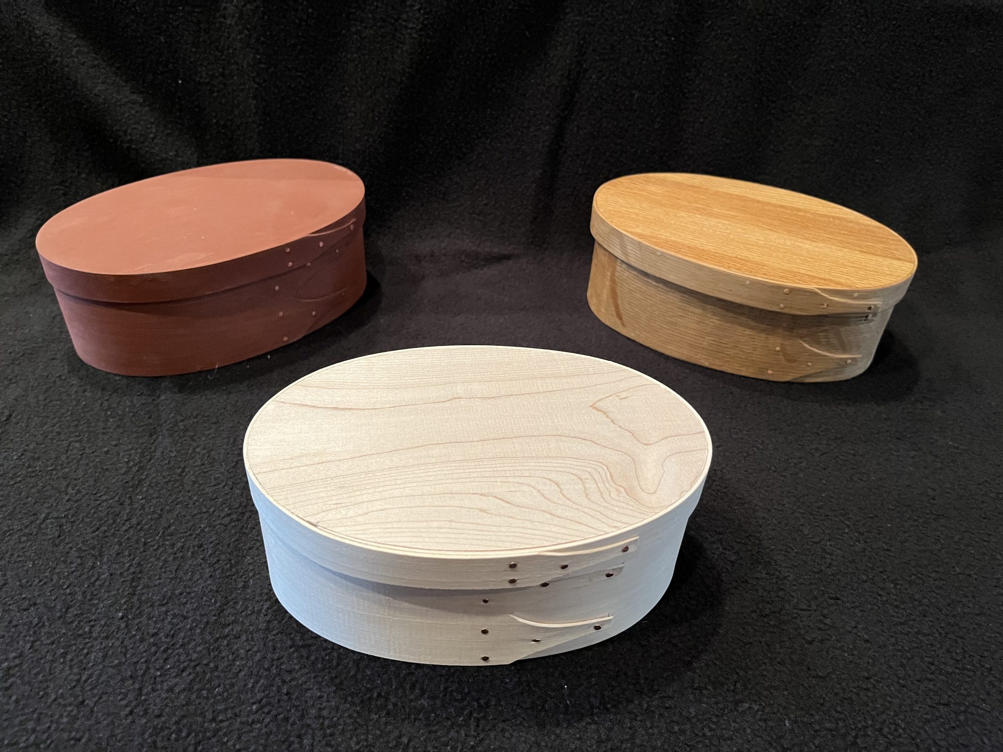 These boxes are the same size but with differing woods and finishes.  Two are maple (one with clear coat and one with milk paint).  The third is quartersawn white oak